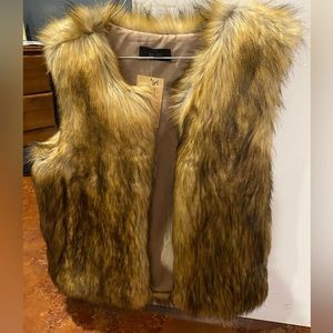 Fur Vest NWT hits right at the waist longer fit than crop